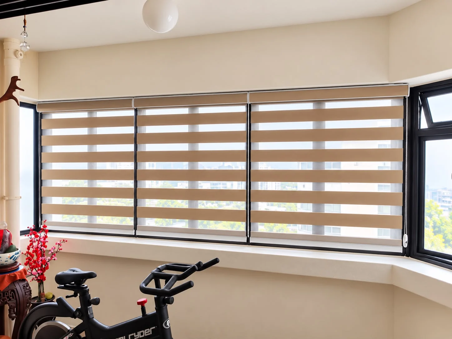 Warm neutral combi blinds fitted across three wide living-room windows